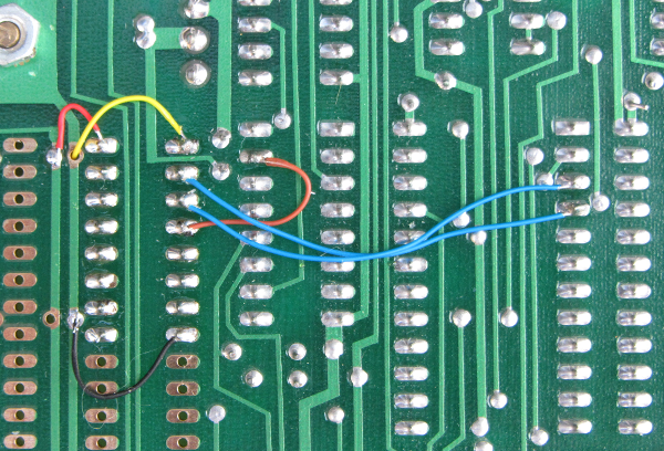 Photo of the PCB solder side modification using half of a 74LS139.